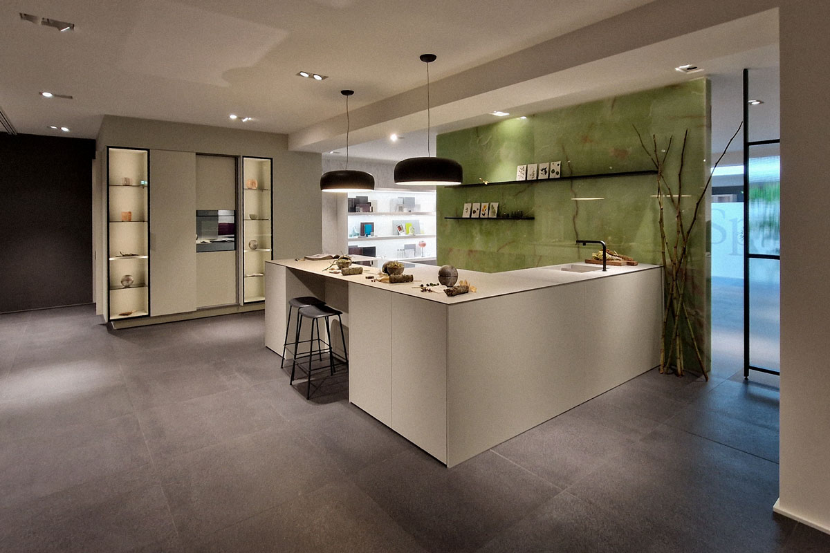 +SEGMENTO–Vitrine_Mit-Jorge-Pensi-bei-Poggenpohl +SEGMENTO Y mit Steinrückwand und Vitrine